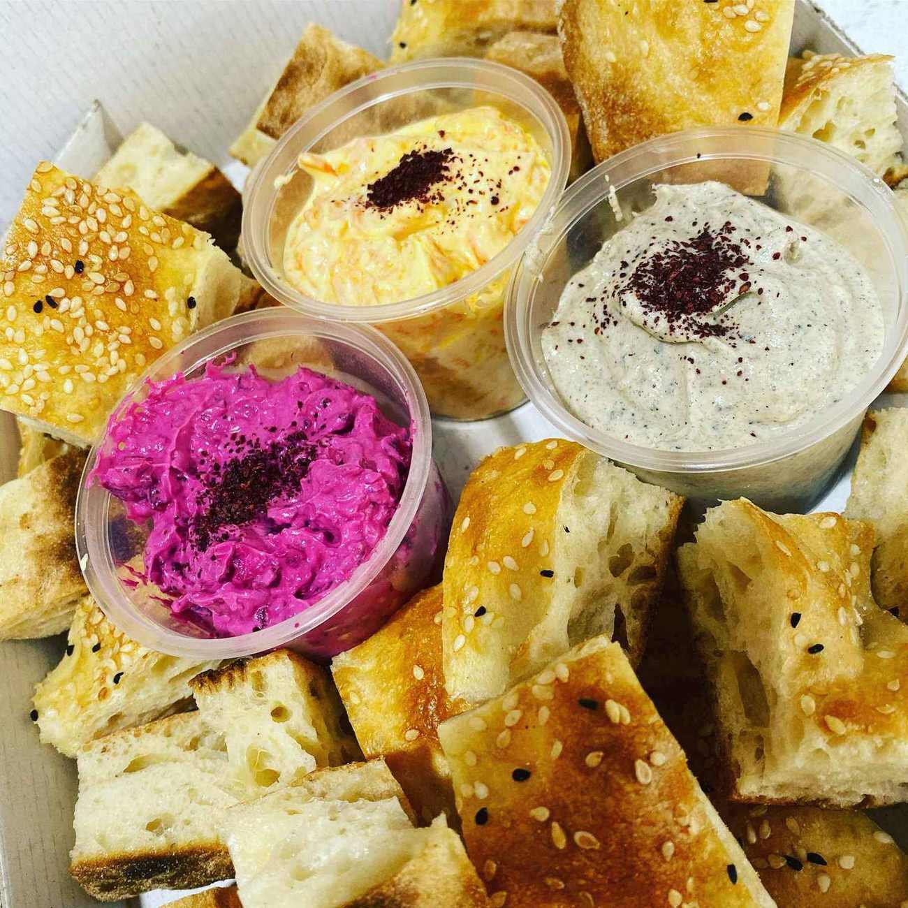 Beetroot, carrot and eggplant dips with fresh Turkish bread
